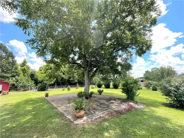 A spacious yard with mature trees offers ample room for outdoor activities and relaxation.