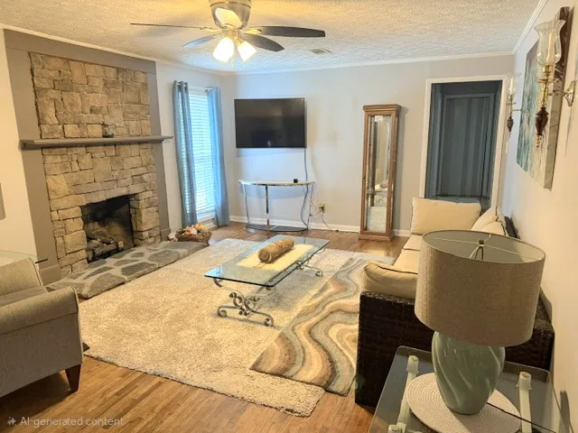 A robust stone fireplace creates a warm focal point in this cozy living space.