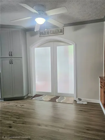 Functional kitchen space with durable flooring and direct access to another area.