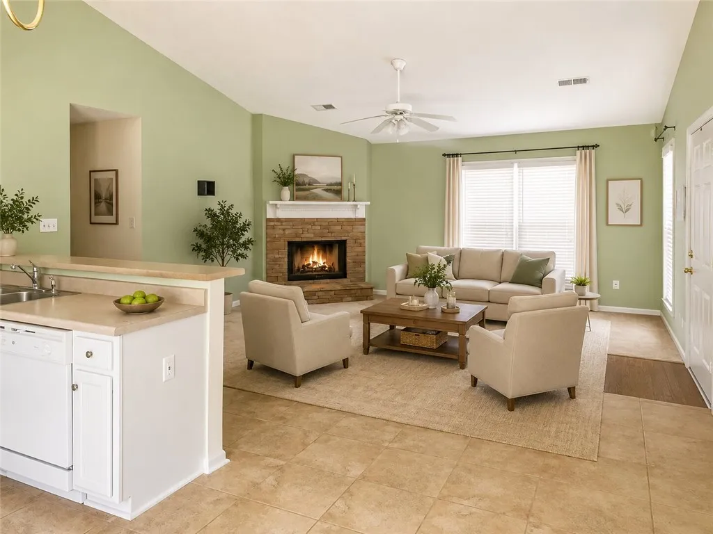 Virtual Staging. A welcoming living space features a cozy fireplace and convenient pass-through to the kitchen.