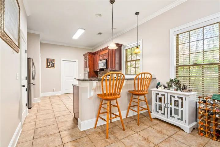 Functional kitchen with ample cabinet space and a convenient breakfast bar.