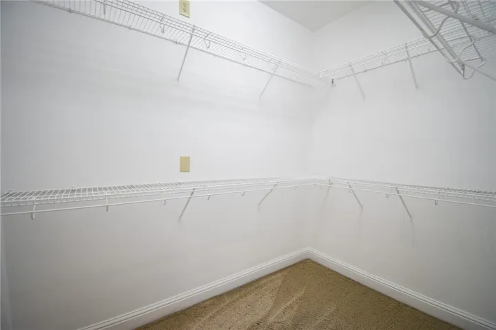 Functional wire shelving and ample space define this well-appointed closet.