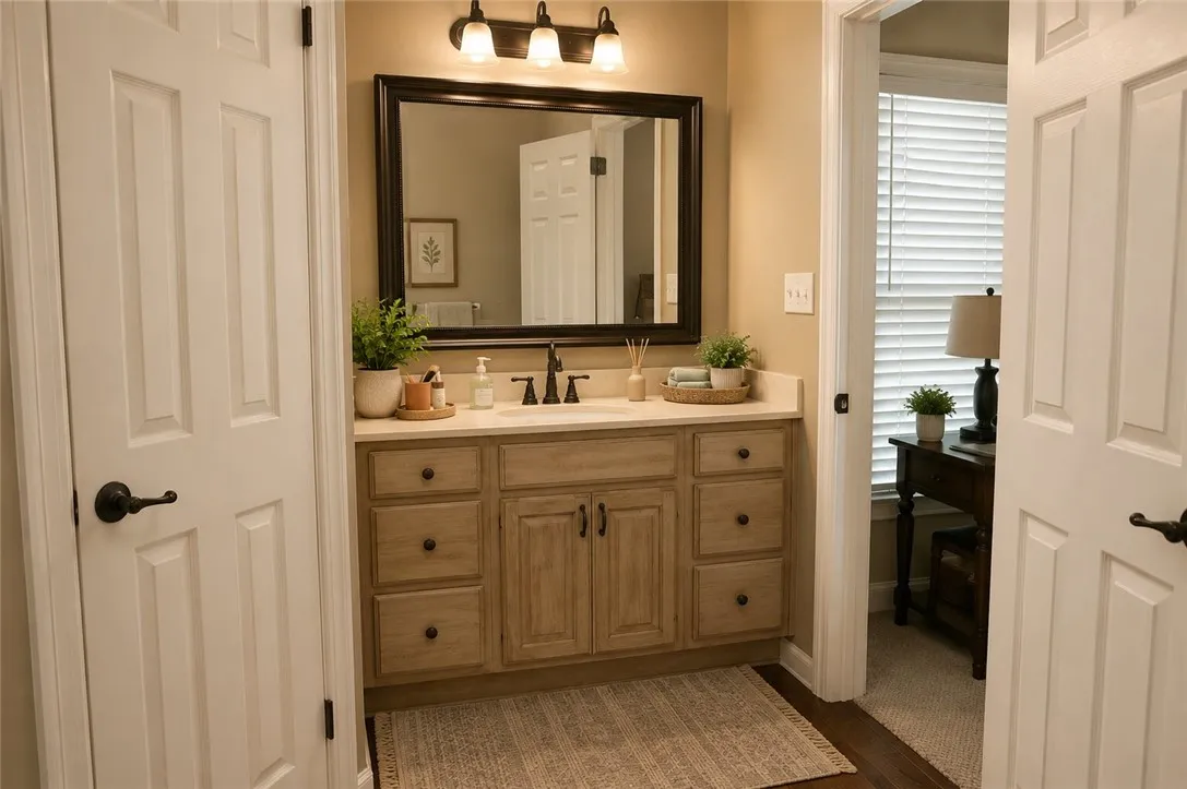 A well-appointed bathroom vanity with ample storage and a warm, inviting ambiance.