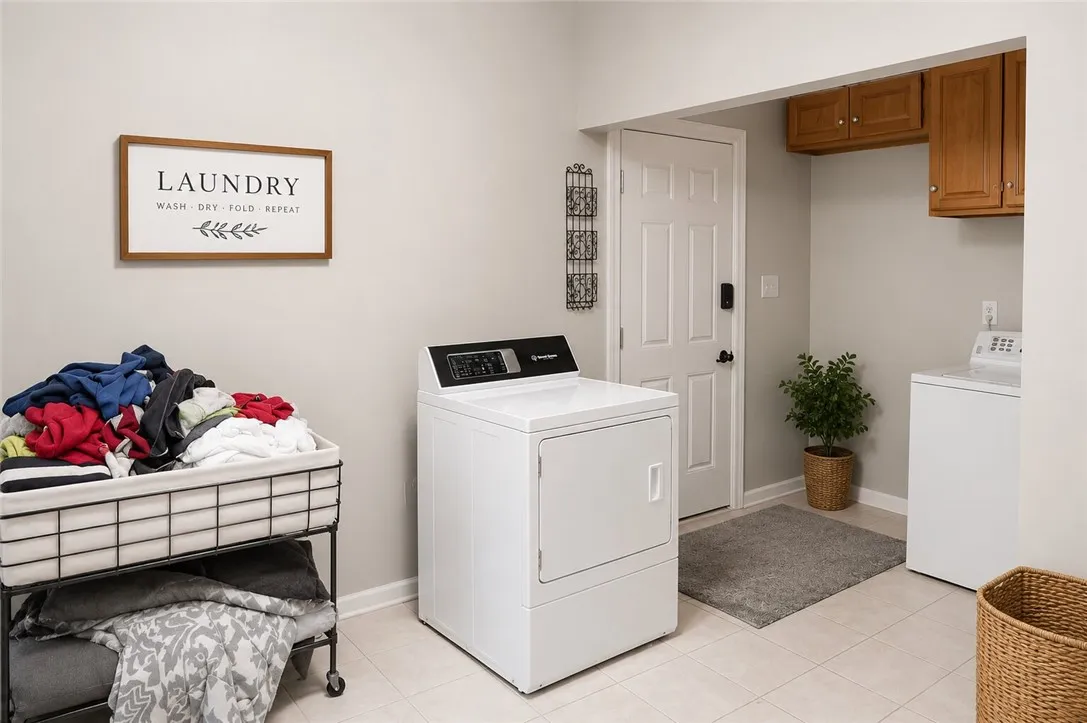 Functional laundry room offers convenient appliances and ample storage.