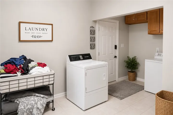 Functional laundry room offers convenient appliances and ample storage.