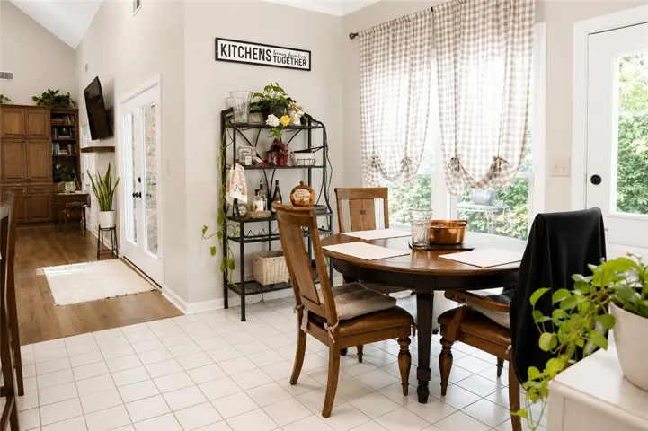 Natural light streams into this delightful dining area, perfect for everyday meals and casual gatherings.