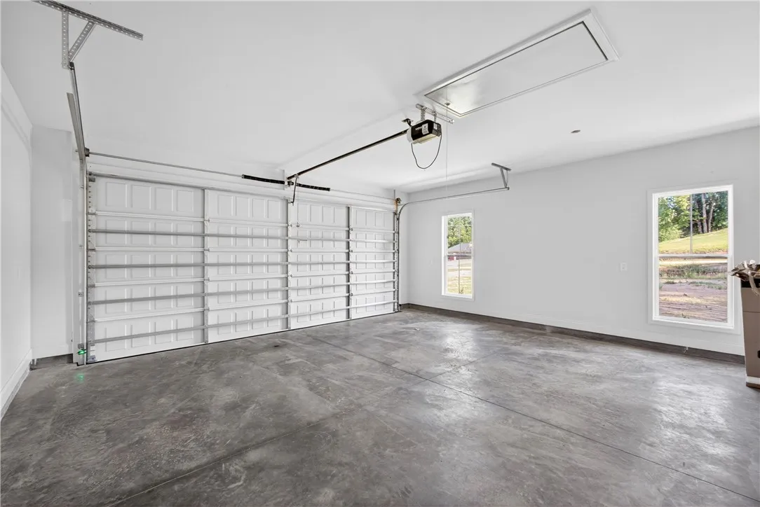 Secure parking and extra storage space are provided by this clean, functional garage.