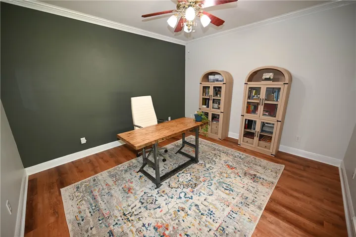 Currently used a home office, this flex space immediately off of the foyer would also make a lovely formal living room.