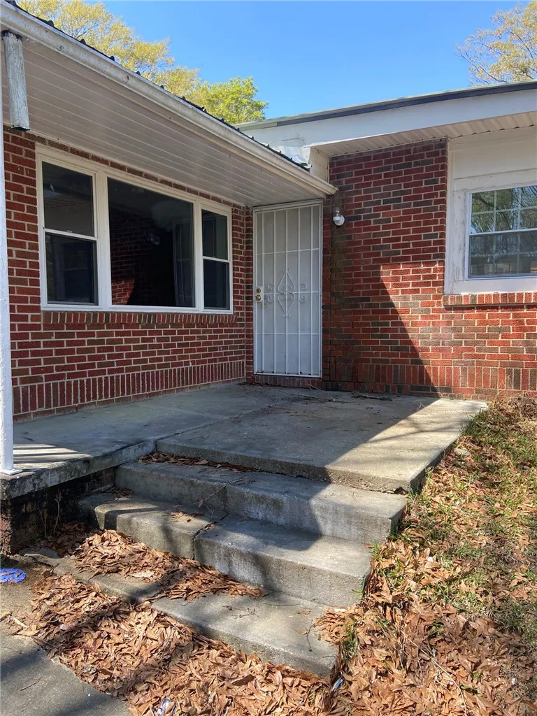 A classic brick exterior offers enduring charm and a secure entry.
