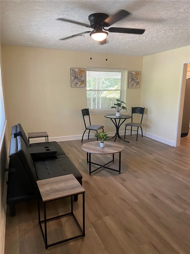Laminate flooring adds warmth and functionality to this inviting living space.