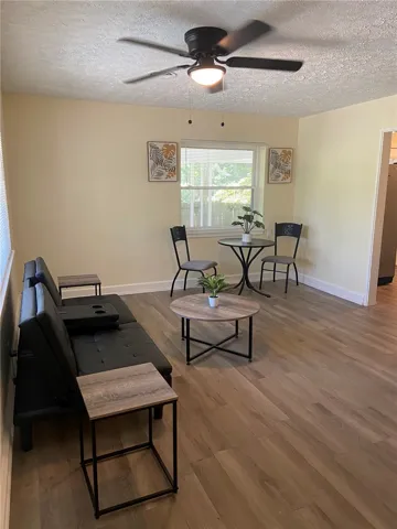 Laminate flooring adds warmth and functionality to this inviting living space.