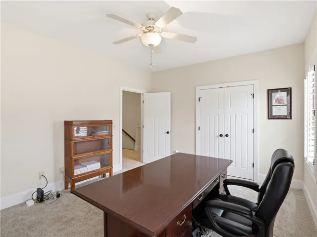 A quiet and functional study area offers comfort and ample storage solutions.