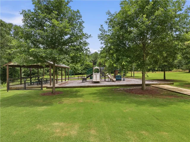 A well-maintained community park offers a picnic pavilion and a vibrant children's playground.