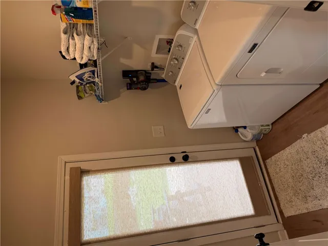 Functional laundry space provides backyard and garage access. New Maytag W/D are negotiable.