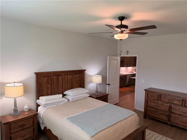 Comfortable bedroom with an inviting atmosphere and wood-toned furnishings.