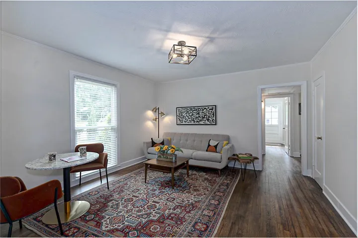 Hardwood floors and bright windows illuminate this comfortable living space. Freshly painted Benjamin Moore Seapearl OC-19 throughout