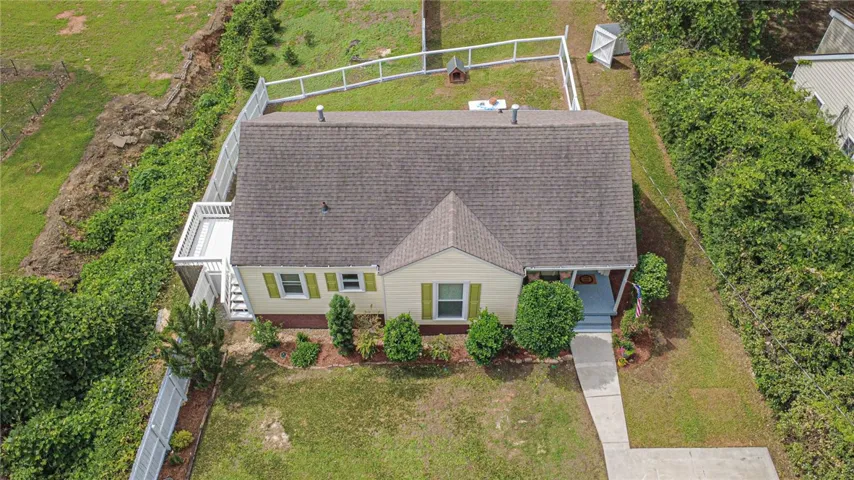 Discover a charming home with an inviting front yard, offering a blend of comfort and outdoor space.