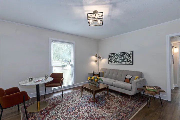 Hardwood floors and bright window light define this inviting living room space.