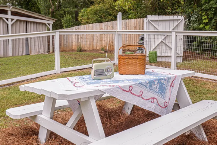 Relax in this fenced yard, ideal for outdoor gatherings.