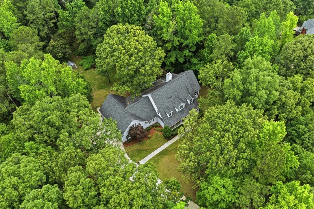 Mature woodlands envelope this multi-level home, creating a private forest retreat.