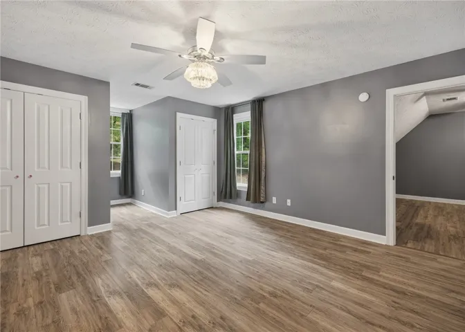 Smooth wood-style flooring and classic trim elevate this versatile second-story space.