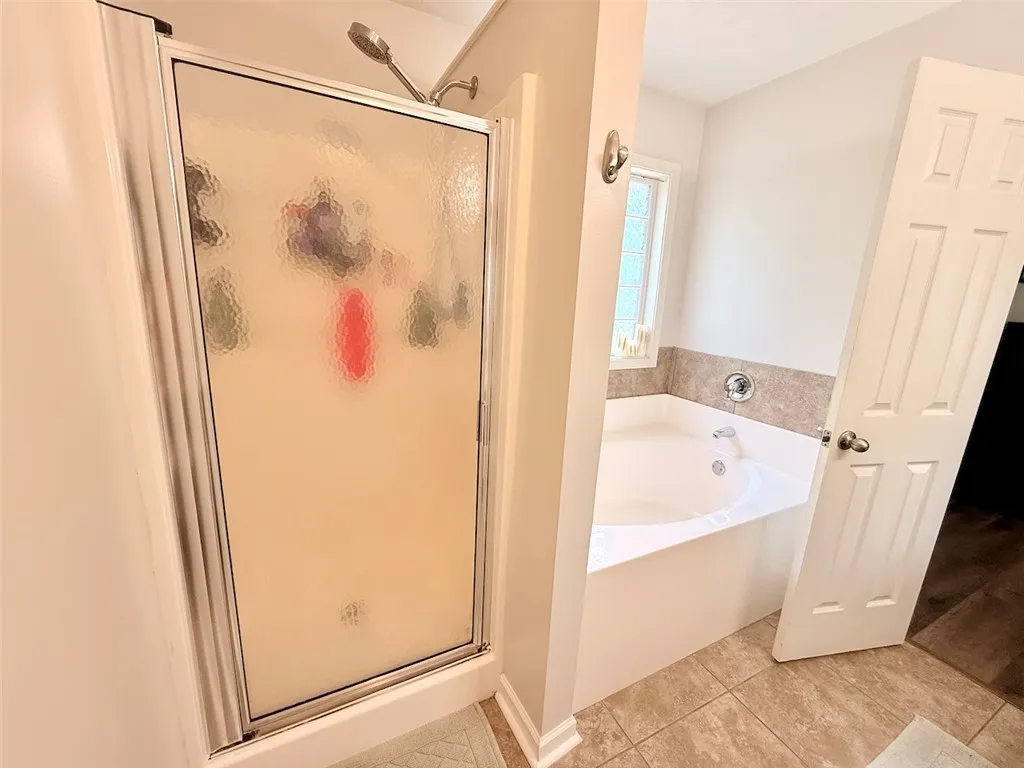 Relax in the pristine soaking tub after a long day.