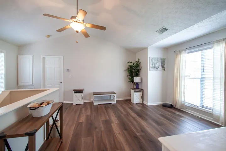 Vaulted ceilings create a spacious, airy living environment.