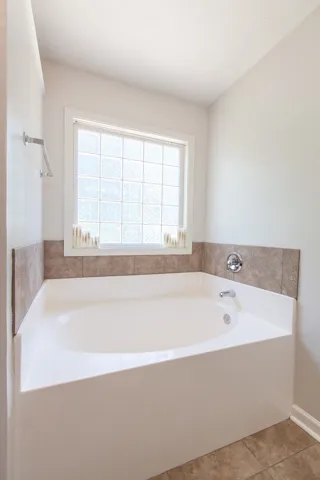 Relax in the pristine soaking tub after a long day.