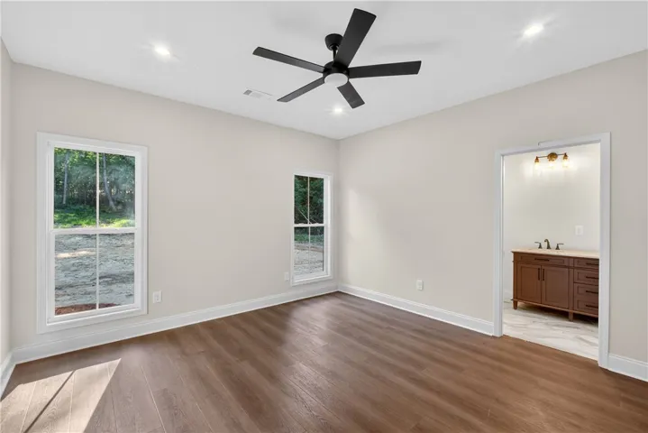 A quiet retreat with durable flooring and direct access to a private bathroom.