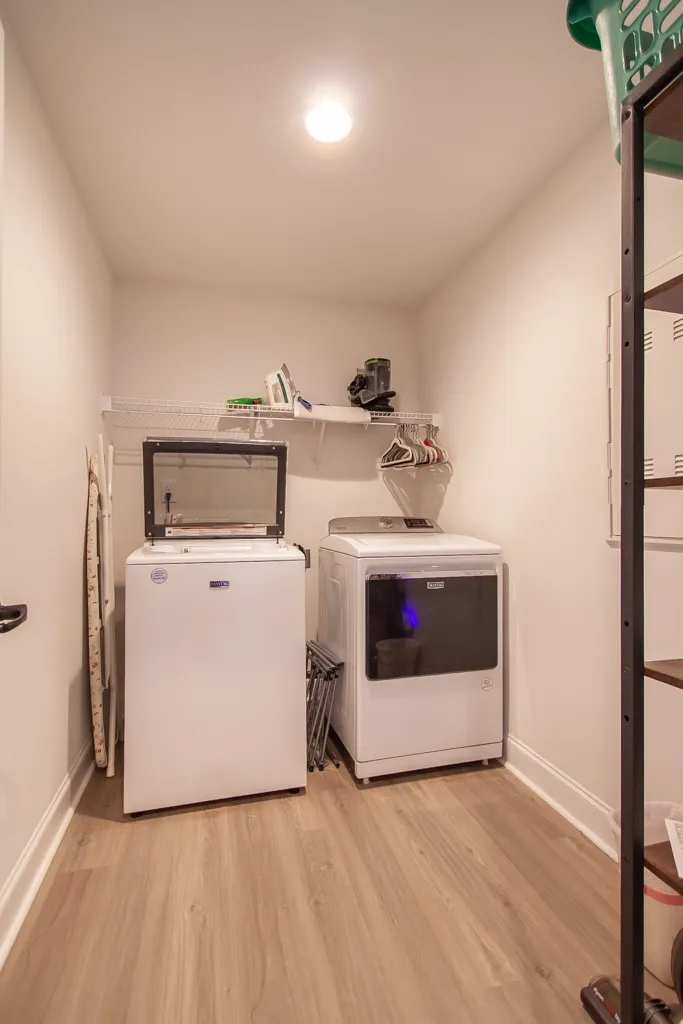 Although the washer and dryer do not stay, there is ample room for yours.