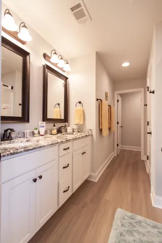 The primary bath offers double vanities and space to share.