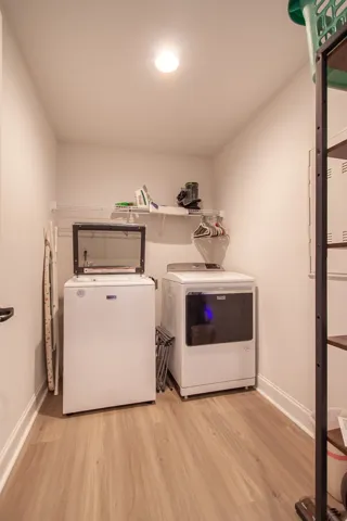 Although the washer and dryer do not stay, there is ample room for yours.