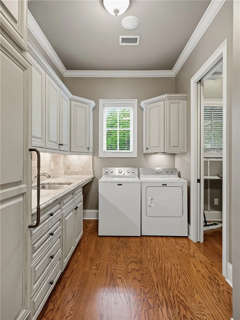 Functional utility room with ample storage and robust wood flooring.