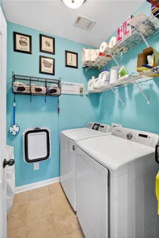 Functional laundry space featuring convenient shelving and efficient appliances.