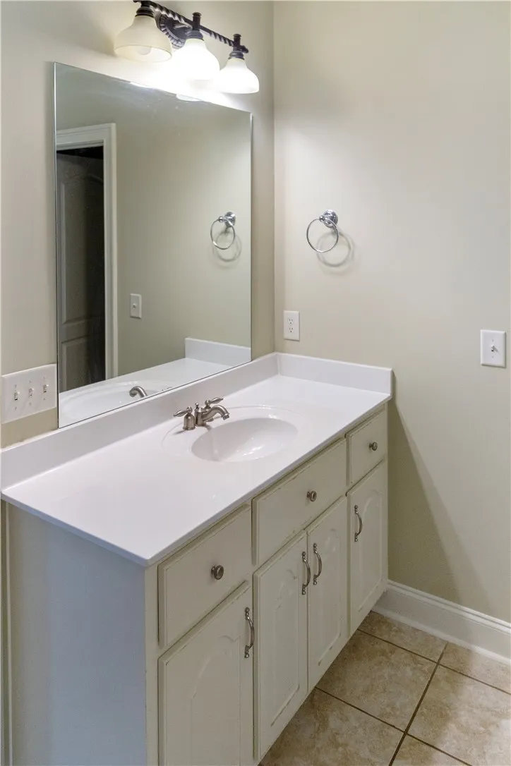 A well-appointed bathroom vanity with ample counter space and a large mirror.