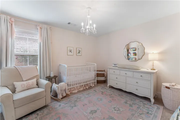 Soft lighting and serene pastels create a tranquil nursery retreat.
