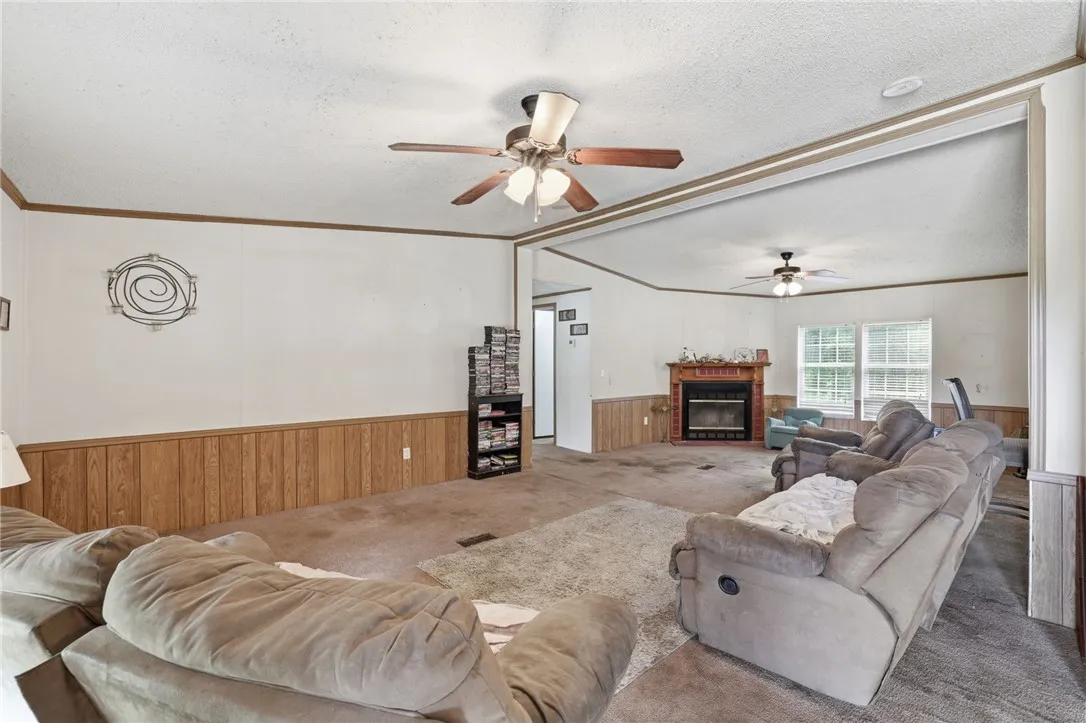 A relaxed living area with a cozy fireplace and inviting atmosphere, perfect for comfortable gatherings.