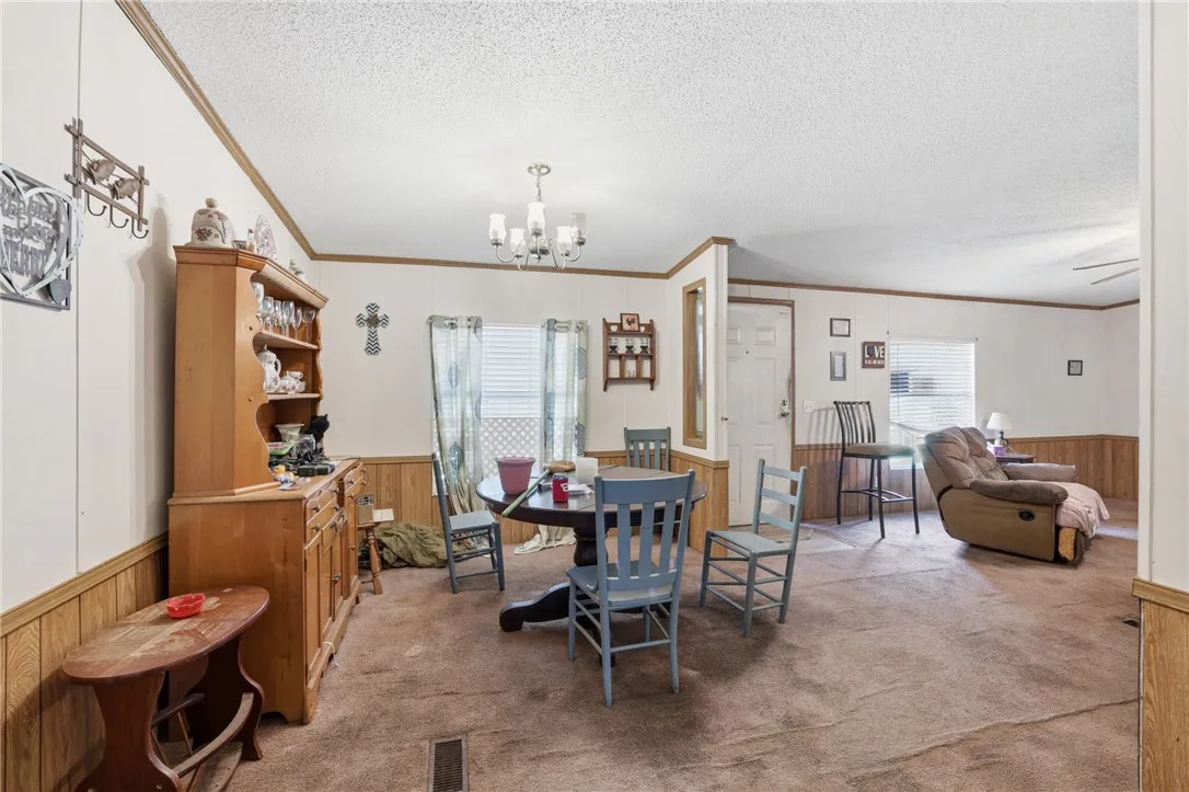 A combined living and dining space provides an adaptable area for daily living.