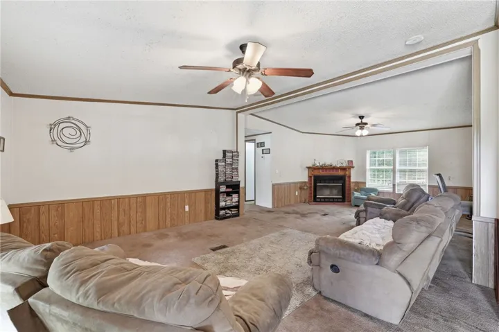 A relaxed living area with a cozy fireplace and inviting atmosphere, perfect for comfortable gatherings.