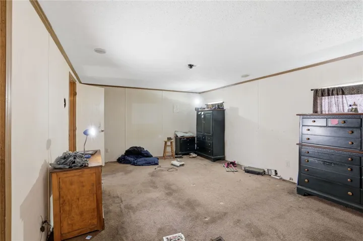 A versatile space offering a simple canvas for personalization and comfort.