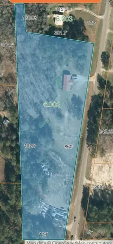 A comprehensive aerial view details the generous dimensions and potential of this expansive land parcel.