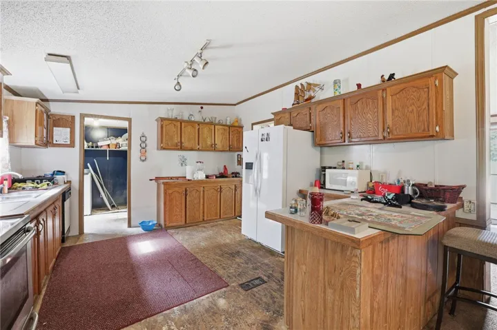 Functional kitchen with ample cabinetry and essential appliances.