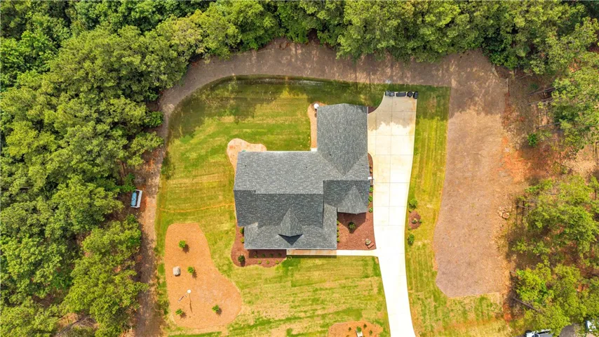Discover a private residence nestled amidst a vibrant, green landscape.