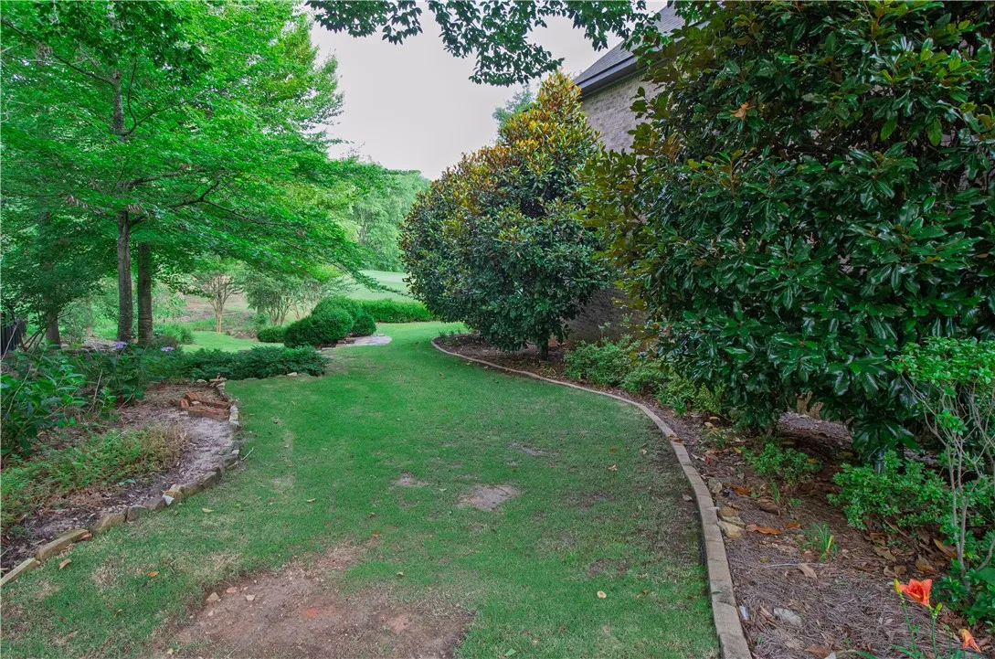 A verdant, well-maintained yard provides a tranquil outdoor retreat.
