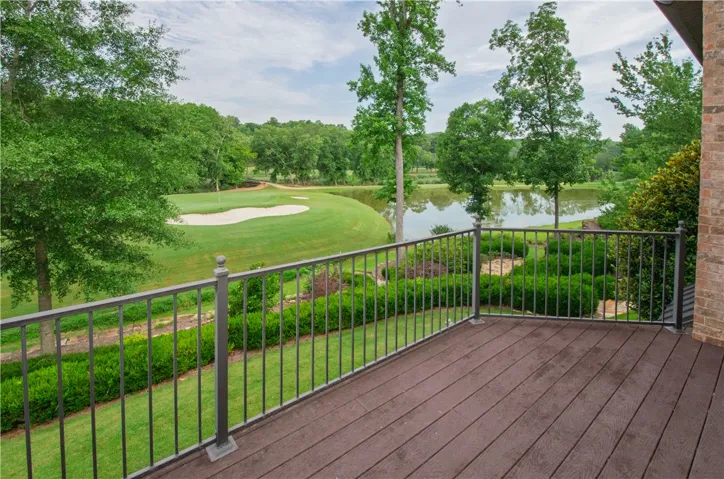 Unwind on this spacious deck, overlooking a serene golf course and tranquil lake.
