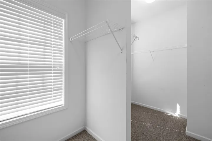 Walk-in closets offer generous storage solutions for an organized home.