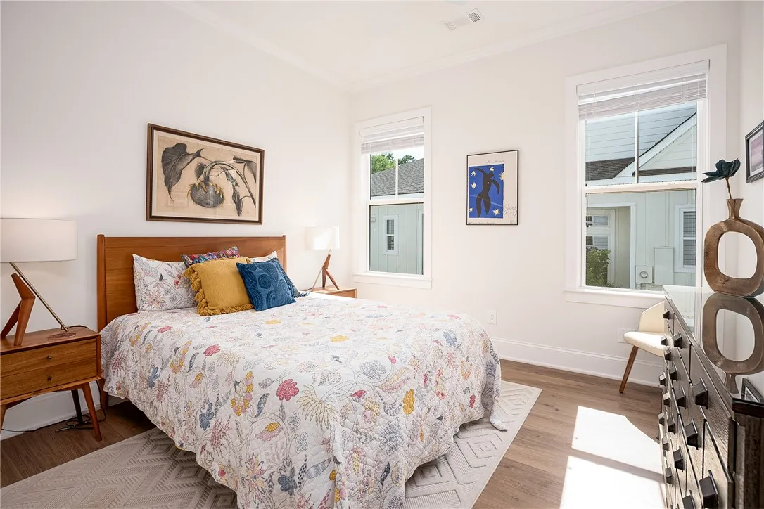 Clean lines and natural light define this inviting bedroom space, offering a tranquil retreat.