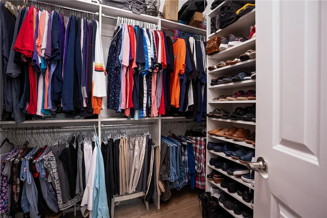 Organized living with ample shelving and hanging space to keep belongings neatly arranged.