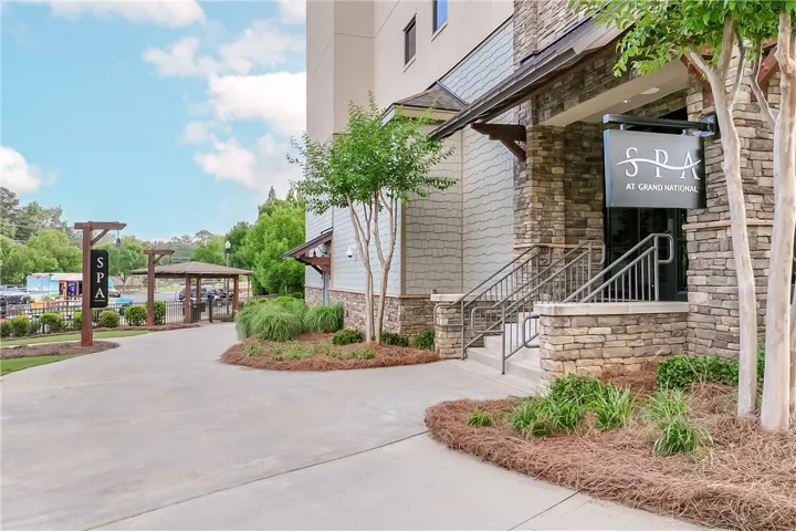 Stone and siding exterior welcomes patrons to a sophisticated wellness retreat.
