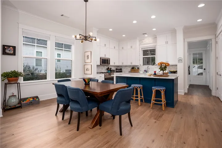 A vibrant kitchen and dining area combine style and function with modern fixtures and ample natural light.